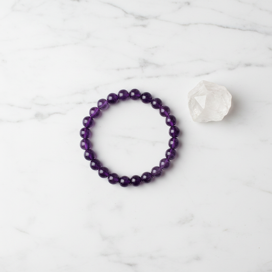 Amethyst bracelet flat lay with crystal
