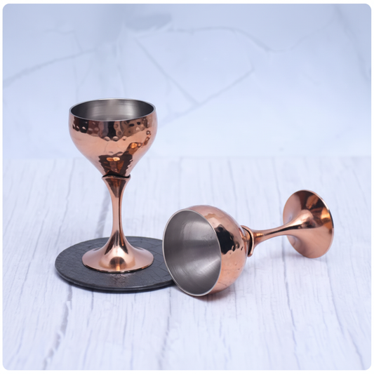 One standing one on side copper goblet glasses