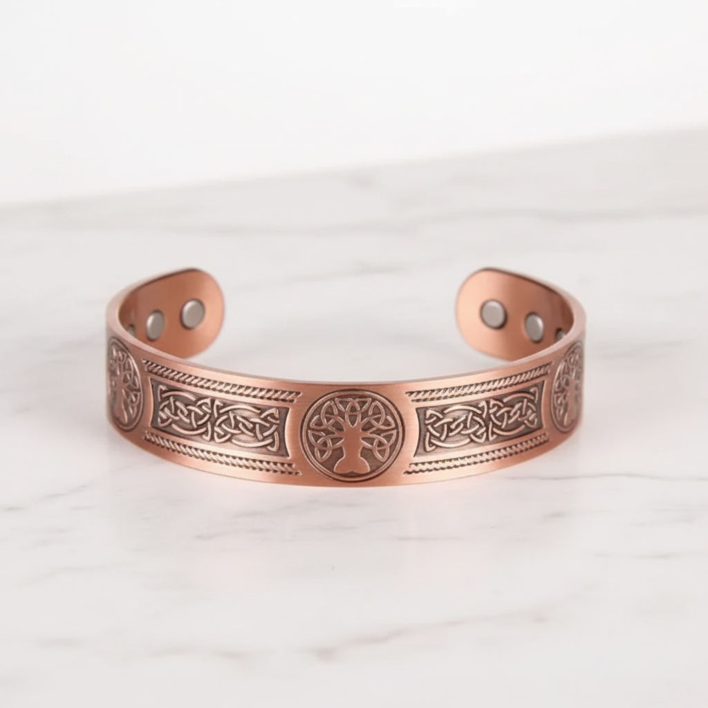 Copper magnetic bracelet flat on white marble