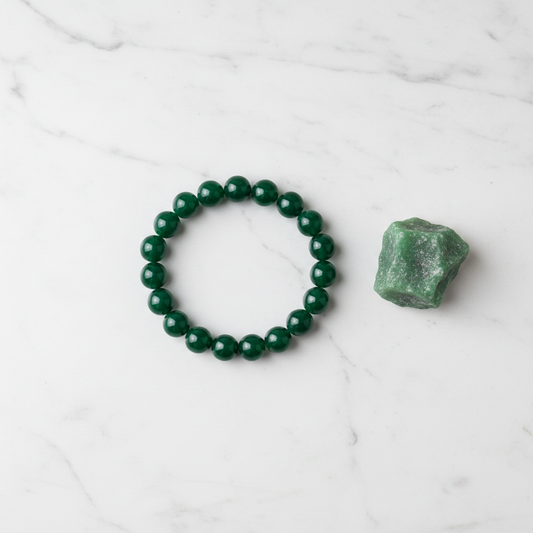Jade bracelet flat lay with raw stone