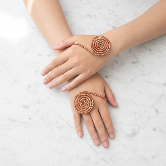 Copper spiral hand rings flat lay overhead
