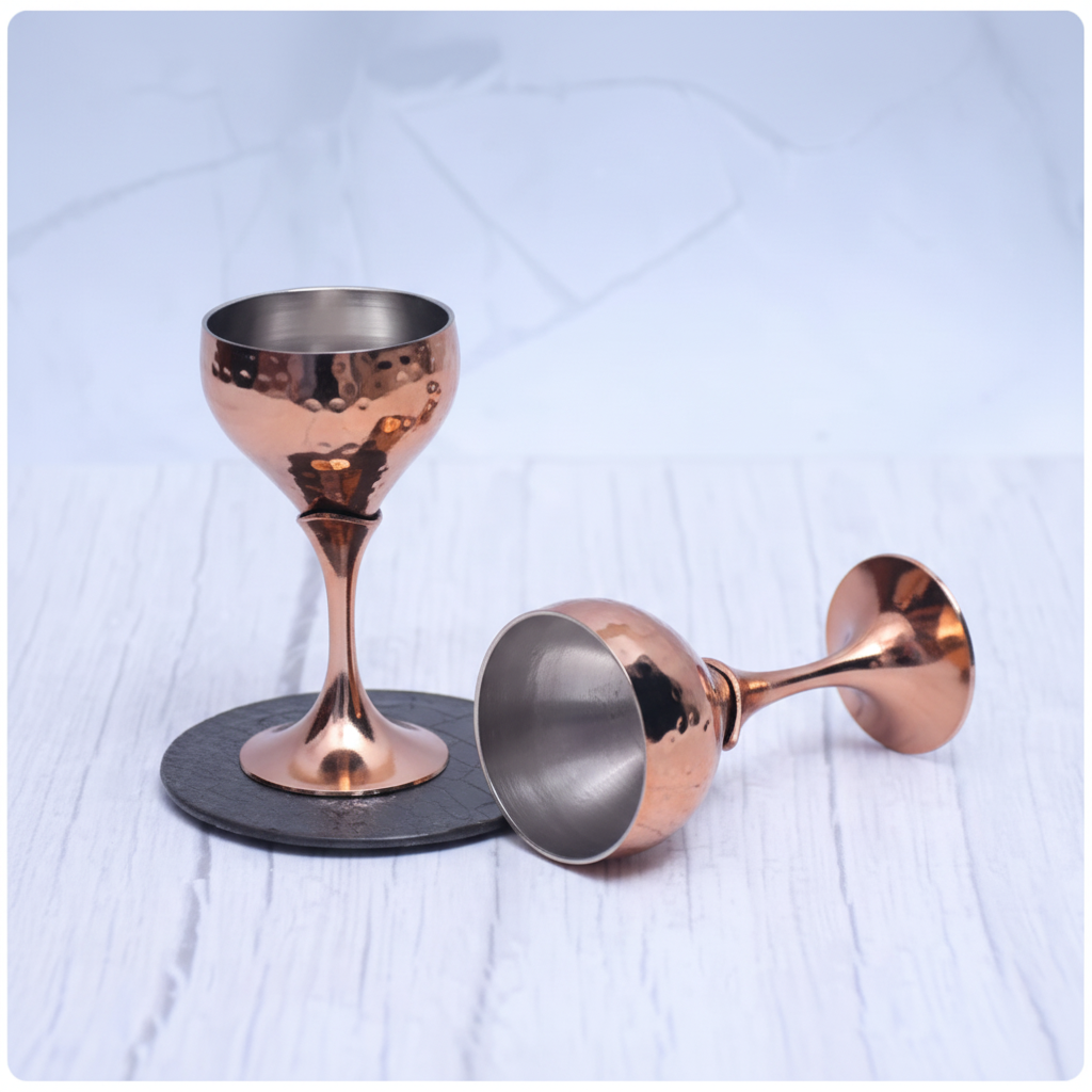 One standing one on side copper goblet glasses