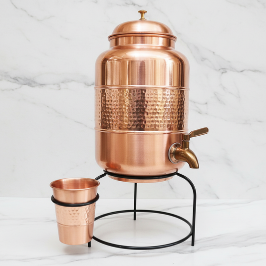 Pure Copper Half Hammered Dark Finish Dispenser with Glass and Stand on white marble
