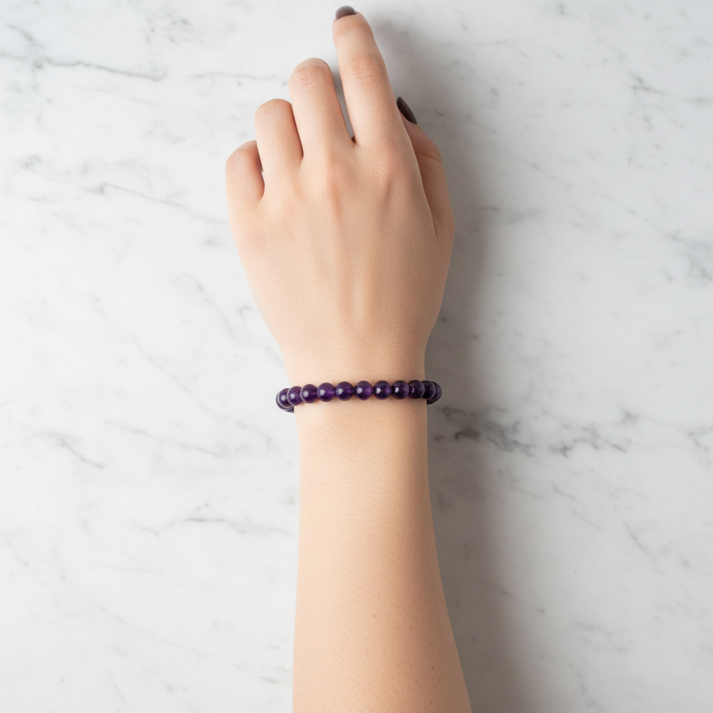 Amethyst bracelet worn on wrist