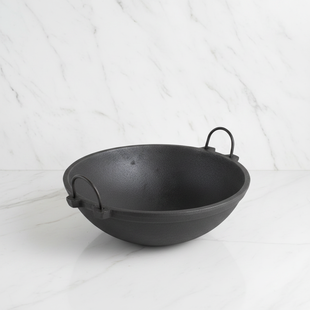 Large Cast Iron Kadai on white marble background - Face of Norway